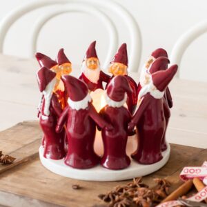 kynttilänalunen tontut harvesttime jossa tontut seisovat piirissä kynttilänalusen ympärillä