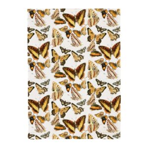 keittiöpyyhe jossa perhoskuvio valkoisella taustalla